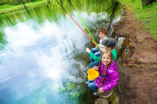 Children fishing in clean ponds